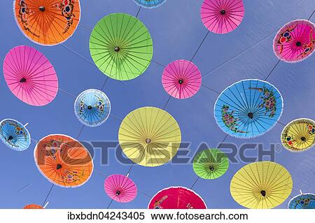Bunte Sonnenschirme hangen in der Luft, Sonnenschirm-Festival in Bo Sang bei Chiang Mai, Thailand, Asien View Large Photo Image Stock Photography - Bunte Sonnenschirme hangen in der Luft, Sonnenschirm-Festival in Bo Sang bei Chiang Mai, Thailand, Asien. Fotosearch