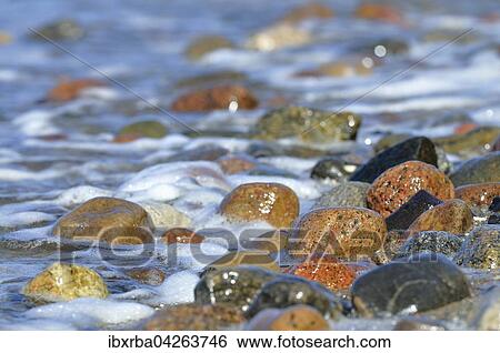 Bunte Steine von Wasser umspult, Hohes Ufer bei Ahrenshoop, Fischland-Darss-Zingst, Mecklenburg-Vorpommern, Deutschland, Europa View Large Photo Image Stock Photograph - Bunte Steine von Wasser umspult, Hohes Ufer bei Ahrenshoop, Fischland-Darss-Zingst, Mecklenburg-Vorpommern, Deutschland, Europa. Fotosearch