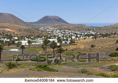 Das Bergdorf Haria mit seinen weissen Hausern, hinten der Vulkan Monte Corona, Maguez, Lanzarote, Kanarische Inseln, Spanien, Europa View Large Photo Image Picture - Das Bergdorf Haria mit seinen weissen Hausern, hinten der Vulkan Monte Corona, Maguez, Lanzarote, Kanarische Inseln, Spanien, Europa. Fotosearch