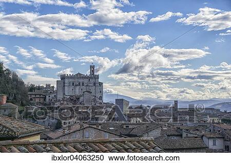 Das Stadtchen Gubbio mit dem Palazzo dei Consoli, blauer Himmel mit Wolken, Gubbio, Umbrien, Italien, Europa View Large Photo Image Stock Image - Das Stadtchen Gubbio mit dem Palazzo dei Consoli, blauer Himmel mit Wolken, Gubbio, Umbrien, Italien, Europa. Fotosearch