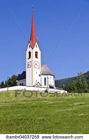 Die Kirche zum Heiligen Nikolaus in Winnebach am Jakobsweg im Hochpustertal an der Grenze zu Osterreich, Sudtirol, Italien, Europa View Large Photo Image Stock Photo - Die Kirche zum Heiligen Nikolaus in Winnebach am Jakobsweg im Hochpustertal an der Grenze zu Osterreich, Sudtirol, Italien, Europa. Fotosearch