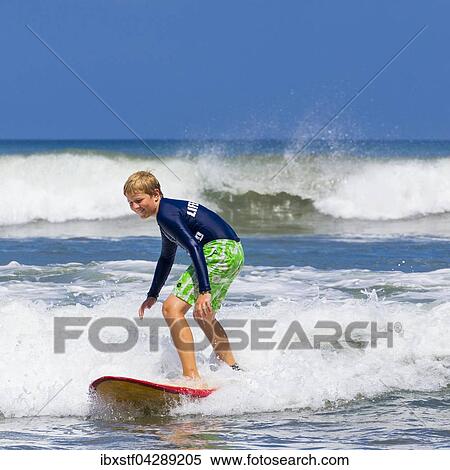 Ein Junge, 12 Jahre, beim Surfen, Kuta, Legian, Strand und Surfparadies, Bali, Indonesien, Asien View Large Photo Image Stock Photography - Ein Junge, 12 Jahre, beim Surfen, Kuta, Legian, Strand und Surfparadies, Bali, Indonesien, Asien. Fotosearch