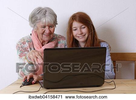Enkelin und Grossmutter am Laptop, Bayern, Deutschland, Europa View Large Photo Image Stock Image - Enkelin und Grossmutter am Laptop, Bayern, Deutschland, Europa. Fotosearch