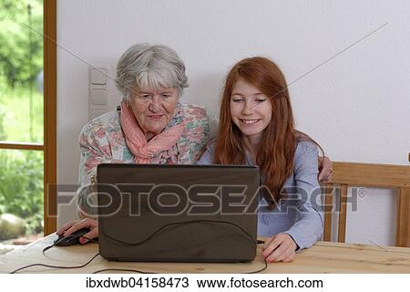 Enkelin und Grossmutter am Laptop, Bayern, Deutschland, Europa View Large Photo Image Stock Image - Enkelin und Grossmutter am Laptop, Bayern, Deutschland, Europa. Fotosearch