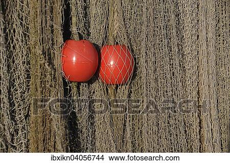 Fischernetze mit zwei roten Schwimmbojen, Travemunde, Schleswig-Holstein, Deutschland, Europa View Large Photo Image Picture - Fischernetze mit zwei roten Schwimmbojen, Travemunde, Schleswig-Holstein, Deutschland, Europa. Fotosearch