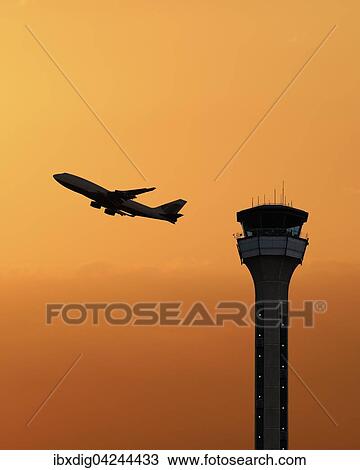 Flugsicherungsturm mit einem startenden Flugzeug bei Sonnenuntergang, Luton Airport, Grossbritannien, Europa View Large Photo Image Stock Image - Flugsicherungsturm mit einem startenden Flugzeug bei Sonnenuntergang, Luton Airport, Grossbritannien, Europa. Fotosearch