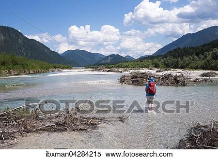 Frau lauft im Flussbett der Isar nahe Sylvensteinspeicher, Isarwinkel, Oberbayern, Bayern, Deutschland, Europa View Large Photo Image Stock Photography - Frau lauft im Flussbett der Isar nahe Sylvensteinspeicher, Isarwinkel, Oberbayern, Bayern, Deutschland, Europa. Fotosearch