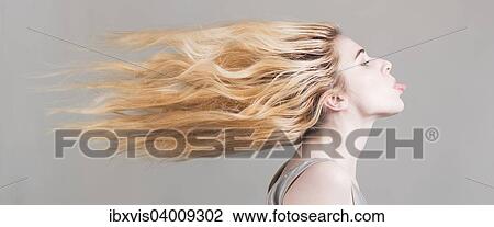 Frau mit wehenden langen blonden Haaren, streckt ihre Zunge raus View Large Photo Image Stock Image - Frau mit wehenden langen blonden Haaren, streckt ihre Zunge raus. Fotosearch