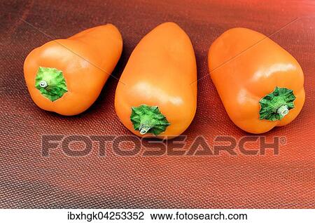 Stock Image - Frische orange Mini Paprika (Capsicum sp. ). Fotosearch