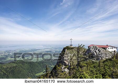 Gipfelkreuz und Hochfellnhaus auf Hochfelln, hinten der Chiemsee, Chiemgauer Alpen, Chiemgau, Oberbayern, Bayern, Deutschland, Europa View Large Photo Image Stock Image - Gipfelkreuz und Hochfellnhaus auf Hochfelln, hinten der Chiemsee, Chiemgauer Alpen, Chiemgau, Oberbayern, Bayern, Deutschland, Europa. Fotosearch
