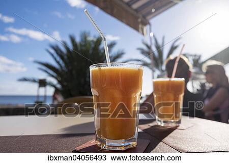 Glaser mit Saft, Strandpromenade, La Playa, Valle Gran Rey, La Gomera, Kanarische Inseln, Spanien, Europa View Large Photo Image Stock Image - Glaser mit Saft, Strandpromenade, La Playa, Valle Gran Rey, La Gomera, Kanarische Inseln, Spanien, Europa. Fotosearch