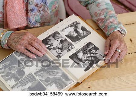 Hande einer Seniorin blattern in einem alten Fotoalbum, Bayern, Deutschland, Europa View Large Photo Image Stock Photo - Hande einer Seniorin blattern in einem alten Fotoalbum, Bayern, Deutschland, Europa. Fotosearch