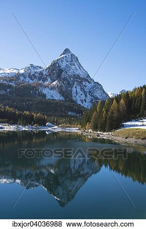 Herbst im Naturpark Riedingtal, Schliereralm, Schlierersee, Spiegelung Riedingspitze, Herbstverfarbung der Larchen, erster Schnee, Zederhaus, Lungau, Salzburg, Osterreich, Europa View Large Photo Image Stock Photo - Herbst im Naturpark Riedingtal, Schliereralm, Schlierersee, Spiegelung Riedingspitze, Herbstverfarbung der Larchen, erster Schnee, Zederhaus, Lungau, Salzburg, Osterreich, Europa. Fotosearch