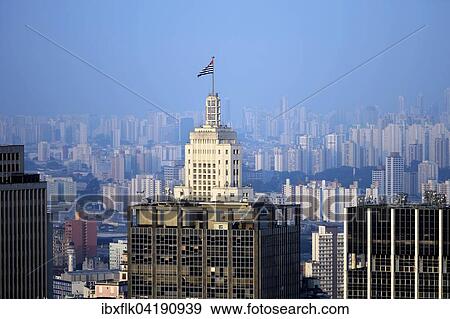 Hochhaus Edificio Banespa mit Fahne des Bundeslandes Sao Paulo vor Grossstadtlandschaft mit Hochhausern, Sao Paulo, Brasilien, Sudamerika View Large Photo Image Stock Photo - Hochhaus Edificio Banespa mit Fahne des Bundeslandes Sao Paulo vor Grossstadtlandschaft mit Hochhausern, Sao Paulo, Brasilien, Sudamerika. Fotosearch