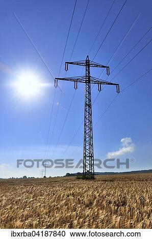 Hochspannungsleitung, Strommast im Getreidefeld vor blauem Himmel, Nordrhein-Westfalen, Deutschland, Europa View Large Photo Image Stock Image - Hochspannungsleitung, Strommast im Getreidefeld vor blauem Himmel, Nordrhein-Westfalen, Deutschland, Europa. Fotosearch