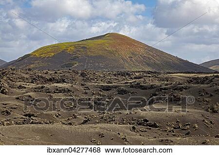 Stock Photo - Hugelige Vulkanlandschaft, Montana Bermeja, Naturpark Los Volcanes, Lanzarote, Kanarische Inseln, Spanien, Europa. Fotosearch