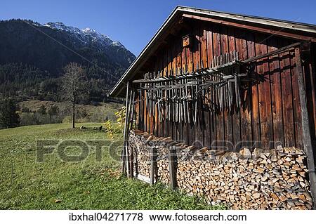 Huinzen, Trockenstangen hangen an einem Holzstadel, Holzschuppen, Hinterstein, Allgau, Bayern, Deutschland, Europa View Large Photo Image Stock Photo - Huinzen, Trockenstangen hangen an einem Holzstadel, Holzschuppen, Hinterstein, Allgau, Bayern, Deutschland, Europa. Fotosearch