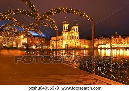 Stock Photo - Jesuitenkirche am Ufer der Reuss in weihnachtlicher Beleuchtung, Altstadt, Luzern, Kanton Luzern, Schweiz, Europa. Fotosearch