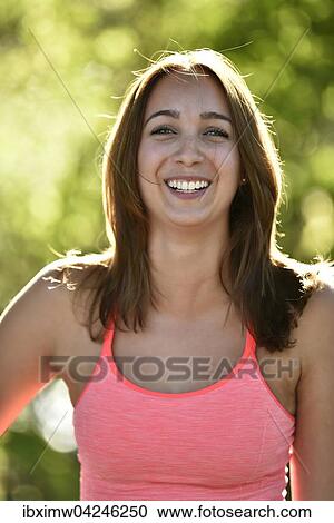 Stock Image - Junge Frau, Portrat im Gegenlicht, Deutschland, Europa. Fotosearch