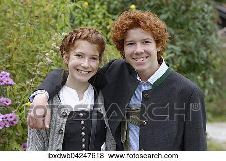 Junge und Madchen, Geschwister in bayerischer Tracht, Dirndl und Lederhose, Oberbayern, Bayern, Deutschland, Europa View Large Photo Image Stock Photo - Junge und Madchen, Geschwister in bayerischer Tracht, Dirndl und Lederhose, Oberbayern, Bayern, Deutschland, Europa. Fotosearch