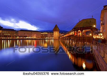 Stock Photograph - Kapellbrucke mit Wasserturm an der Reuss in der Dammerung, Altstadt, Luzern, Kanton Luzern, Schweiz, Europa. Fotosearch