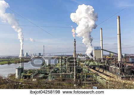 Stock Photo - Kokerei, Stahlwerk am Rhein, Hochofen Schwelgern 1 und 2, hinten Kuhlturm des Kohlekraftwerks Duisburg Walsum, ThyssenKrupp Steel Europe, Hamborn, Duisburg, Nordrhein-Westfalen, Deutschland, Europa. Fotosearch