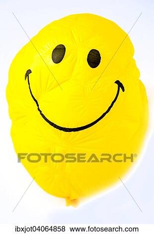 Luftballon, gelb, mit freundlichem Smiley-Gesicht, geschrumpft View Large Photo Image Stock Photo - Luftballon, gelb, mit freundlichem Smiley-Gesicht, geschrumpft. Fotosearch