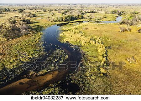 Luftbild, der Gomoti mit angrenzendem Frischwassersumpf, Okavango Delta, Botswana, Afrika View Large Photo Image Stock Photo - Luftbild, der Gomoti mit angrenzendem Frischwassersumpf, Okavango Delta, Botswana, Afrika. Fotosearch