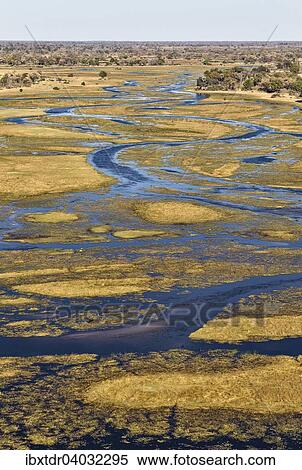 Luftbild, der Gomoti mit seinen Kanalen, Inseln und angrenzendem Frischwassersumpfgebiet, Okavango Delta, Botswana, Afrika View Large Photo Image Stock Photography - Luftbild, der Gomoti mit seinen Kanalen, Inseln und angrenzendem Frischwassersumpfgebiet, Okavango Delta, Botswana, Afrika. Fotosearch