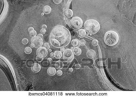 Stock Photo - Lufteinschlusse, Luftblasen im Eis. Fotosearch
