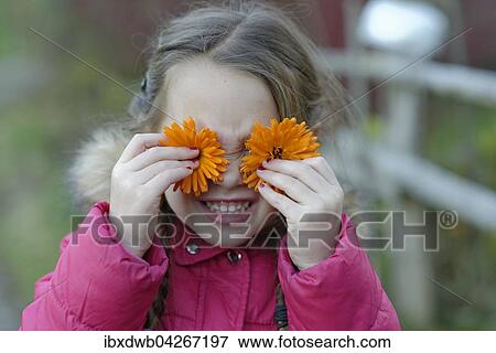 Madchen mit Ringelblumen vor den Augen, Oberbayern, Bayern, Deutschland, Europa View Large Photo Image Stock Photo - Madchen mit Ringelblumen vor den Augen, Oberbayern, Bayern, Deutschland, Europa. Fotosearch