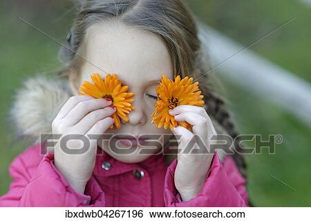 Madchen mit Ringelblumen vor den Augen, Oberbayern, Bayern, Deutschland, Europa View Large Photo Image Stock Photograph - Madchen mit Ringelblumen vor den Augen, Oberbayern, Bayern, Deutschland, Europa. Fotosearch
