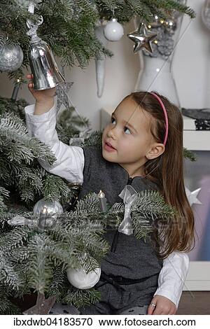 Madchen unter einem Weihnachtsbaum mit Christbaumschmuck, Bayern, Deutschland, Europa View Large Photo Image Stock Image - Madchen unter einem Weihnachtsbaum mit Christbaumschmuck, Bayern, Deutschland, Europa. Fotosearch