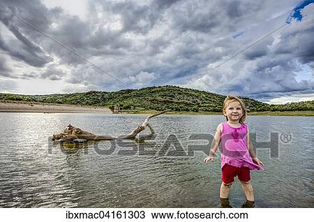 Madchen, zwei Jahre, steht im Wasser, Avis Dam, Windhoek, Namibia, Afrika View Large Photo Image Stock Image - Madchen, zwei Jahre, steht im Wasser, Avis Dam, Windhoek, Namibia, Afrika. Fotosearch