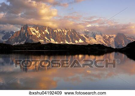 Stock Photo - Mont Blanc Massiv im Abendlicht spiegelt sich im Lac de Chesserys, Chamonix, Frankreich, Europa. Fotosearch