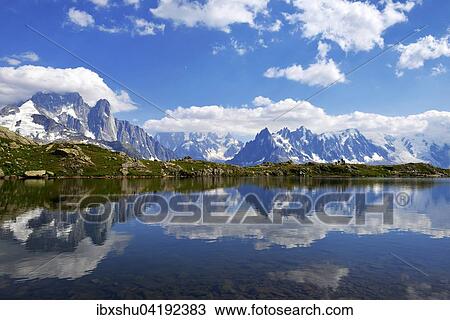 Mont Blanc Massiv spiegelt sich im Lac de Chesserys, links Aiguilles de Chamonix, Chamonix, Frankreich, Europa View Large Photo Image Stock Image - Mont Blanc Massiv spiegelt sich im Lac de Chesserys, links Aiguilles de Chamonix, Chamonix, Frankreich, Europa. Fotosearch