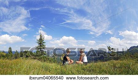 Mutter und Tochter rasten am Weisenbachkopf mit Ausblick in die Tegernseer Berge, Wildbad Kreuth, Bayern, Deutschland, Europa View Large Photo Image Stock Image - Mutter und Tochter rasten am Weisenbachkopf mit Ausblick in die Tegernseer Berge, Wildbad Kreuth, Bayern, Deutschland, Europa. Fotosearch