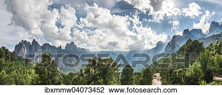 Panorama, Strasse durch ein Tal mit Felsenklippen zwischen Wolken, Col de Bavella, Bavella-Massiv, Korsika, Frankreich, Europa View Large Photo Image Stock Image - Panorama, Strasse durch ein Tal mit Felsenklippen zwischen Wolken, Col de Bavella, Bavella-Massiv, Korsika, Frankreich, Europa. Fotosearch