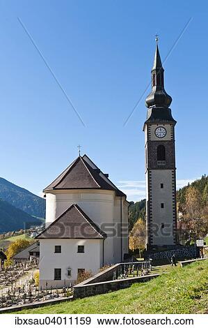 Stock Photo - Pfarrkirche St. Peter, frei stehender Glockenturm mit Zwiebelhaube, Barock, Dolomiten, Villnoss, Villnosstal, Sudtirol, Trentino-Sudtirol, Italien, Europa. Fotosearch