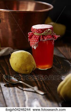Picture - Quittengelee und Fruchte auf Holztisch. Fotosearch