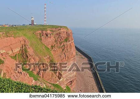 Stock Photography - Roter Fels mit Leuchtturm und Sendemast und Nordsee, Helgoland, Schleswig-Holstein, Deutschland, Europa. Fotosearch