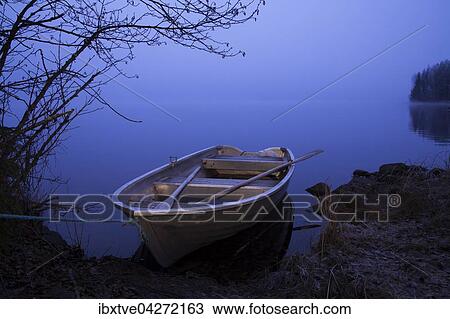 Ruderboot liegt am Ufer am See bei Nebel, Varmeln, Varmland, Schweden, Europa View Large Photo Image Stock Image - Ruderboot liegt am Ufer am See bei Nebel, Varmeln, Varmland, Schweden, Europa. Fotosearch