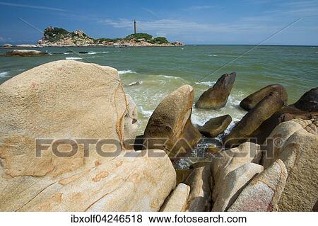 Sandsteine in der Brandung, hinten hochster Leuchtturm von Vietnam, Phan Thiet, Ke Ga, Vietnam, Asien View Large Photo Image Stock Photo - Sandsteine in der Brandung, hinten hochster Leuchtturm von Vietnam, Phan Thiet, Ke Ga, Vietnam, Asien. Fotosearch