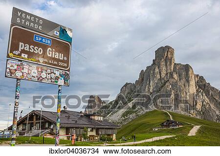 Schild und Berghutte am Passo di Giau vor Berg Gusela, Dolomiten, Venetien, Italien, Europa View Large Photo Image Picture - Schild und Berghutte am Passo di Giau vor Berg Gusela, Dolomiten, Venetien, Italien, Europa. Fotosearch