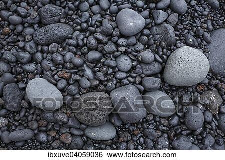 Schwarzes Lavagestein von der Brandung an der Meereskuste rundgeschliffenes Vulkangestein, vulkanisches Geroll, bei Los Hervideros, Lanzarote, Kanarische Inseln, Spanien, Europa View Large Photo Image Stock Photograph - Schwarzes Lavagestein von der Brandung an der Meereskuste rundgeschliffenes Vulkangestein, vulkanisches Geroll, bei Los Hervideros, Lanzarote, Kanarische Inseln, Spanien, Europa. Fotosearch