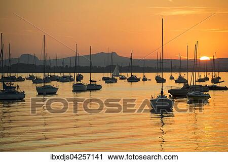 Segelboote auf dem Untersee, Sonnenuntergang, Allensbach, Bodensee, Baden-Wurttemberg, Deutschland, Europa View Large Photo Image Stock Image - Segelboote auf dem Untersee, Sonnenuntergang, Allensbach, Bodensee, Baden-Wurttemberg, Deutschland, Europa. Fotosearch