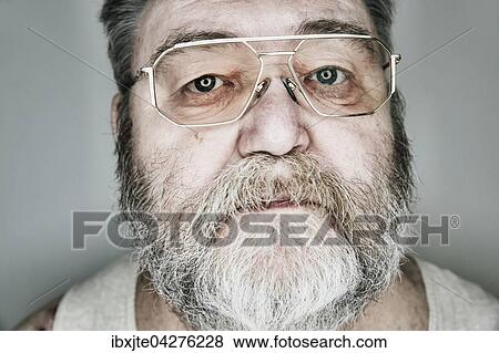 Stock Photo - Senior mit Vollbart und Brille, Portrait, Deutschland, Europa. Fotosearch