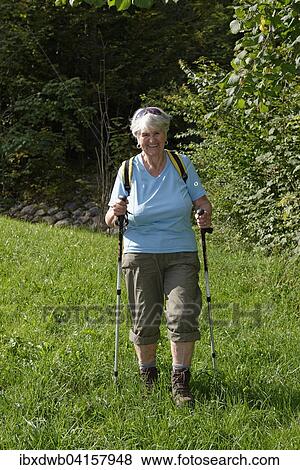 Seniorin, 81 Jahre, beim Wandern, Nordic Walking, Oberbayern, Bayern, Deutschland, Europa View Large Photo Image Stock Photo - Seniorin, 81 Jahre, beim Wandern, Nordic Walking, Oberbayern, Bayern, Deutschland, Europa. Fotosearch