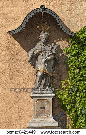 Stock Image - Skulptur vom heiligen Nepomuk mit Baldachin, Going am Wilden Kaiser, Tirol, Osterreich, Europa. Fotosearch