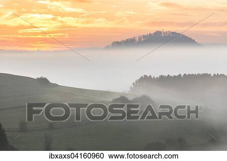 Sonnenaufgang uber dem Hochnebel mit Ausblick zum Hohenhewen, Watterdingen, Tengen, Baden-Wurttemberg, Deutschland, Europa View Large Photo Image Stock Image - Sonnenaufgang uber dem Hochnebel mit Ausblick zum Hohenhewen, Watterdingen, Tengen, Baden-Wurttemberg, Deutschland, Europa. Fotosearch